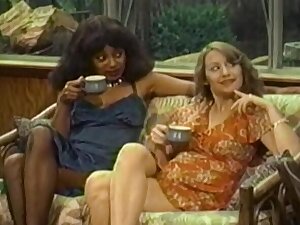 Retro porn video not far from interracial FFM threesome exposed to the sofa