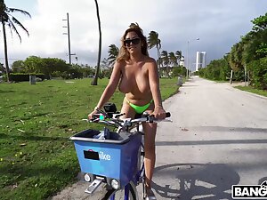 Dirty cougar Jazmyn rides a bike topless plus gets fucked good